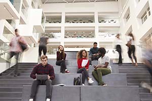 Image of college students sitting on steps