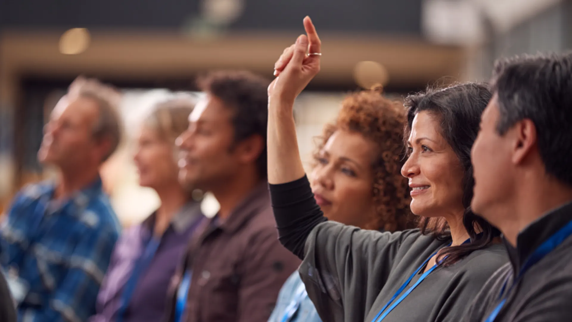 Businesswoman raising hand