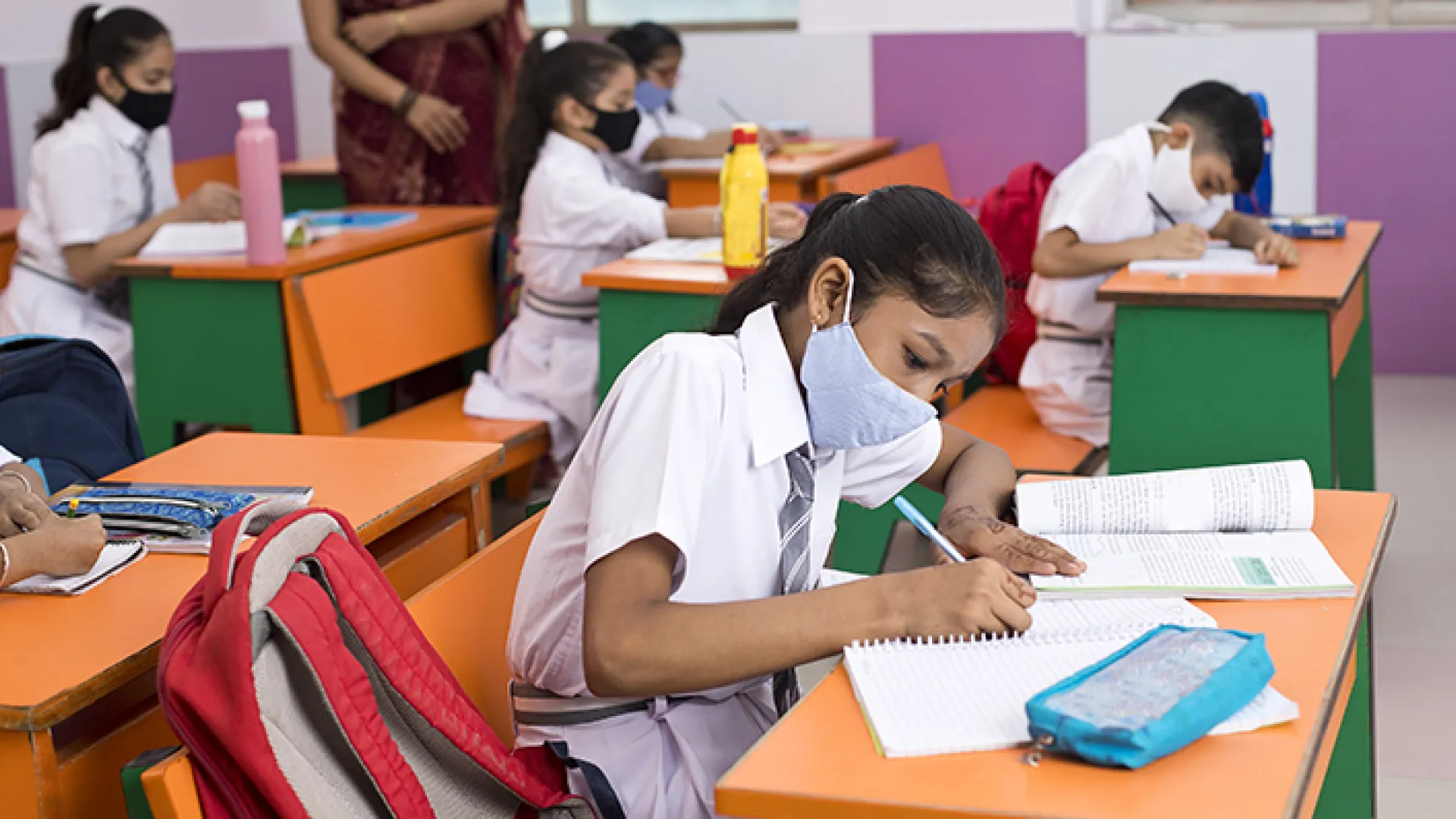 Indian girl studying in classroom