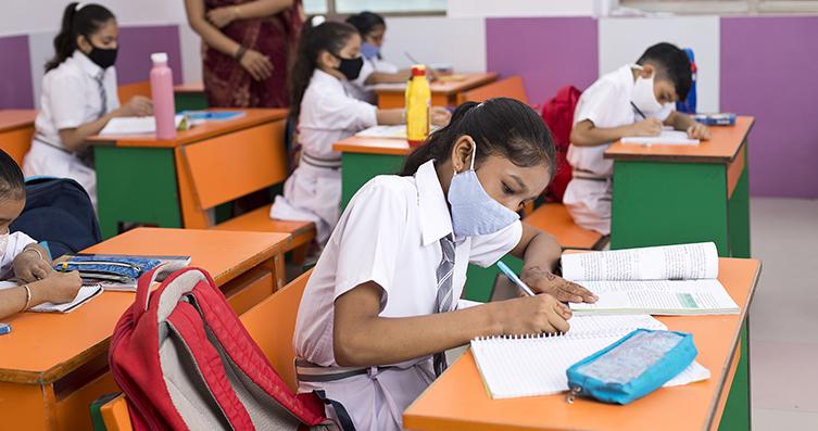 Indian girl studying in classroom