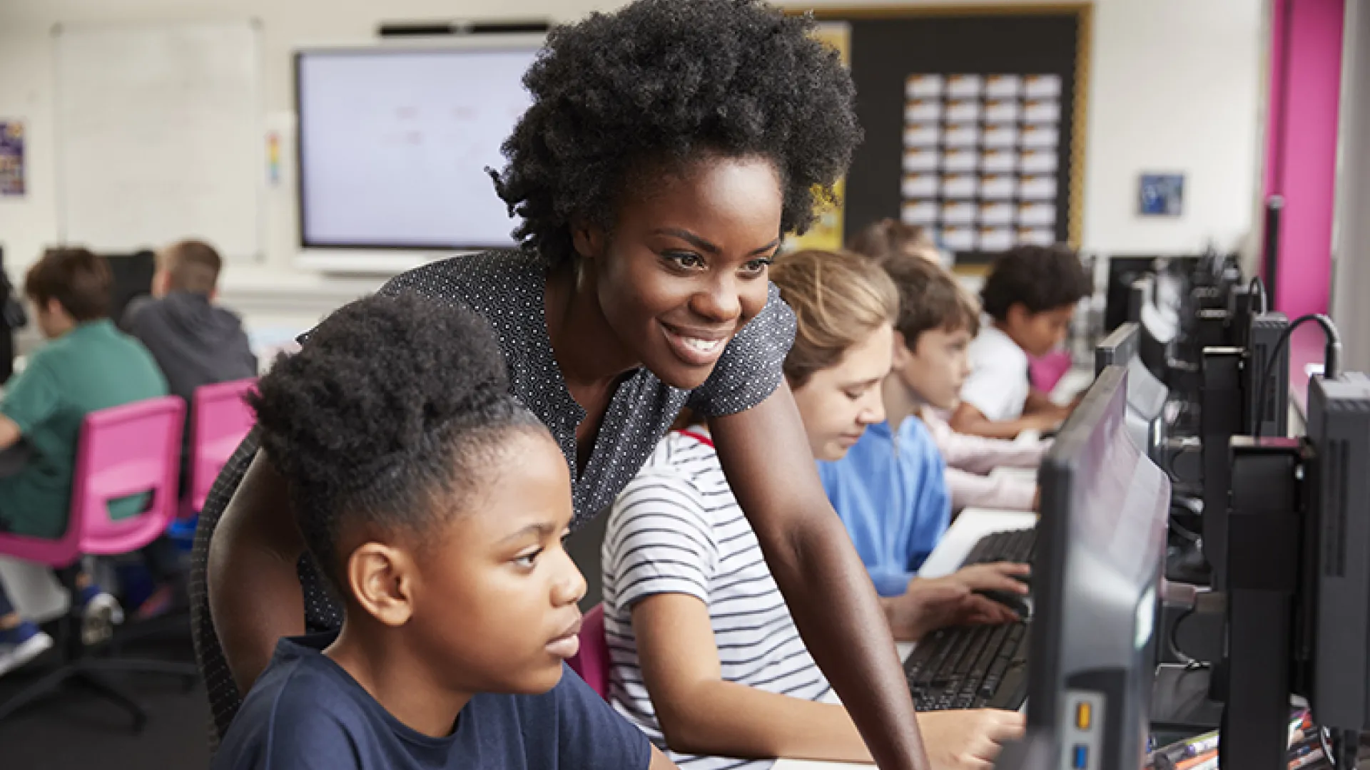 Computer science teacher with young student