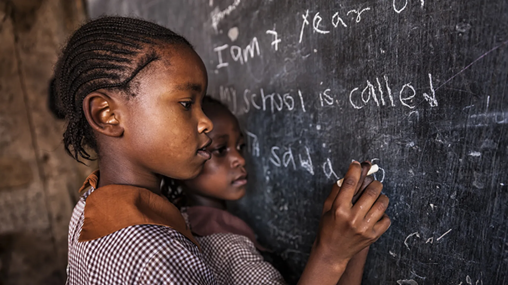 African girls at chalkboard