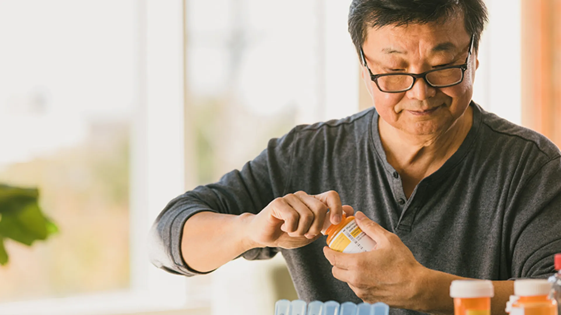 Older man with prescription bottle