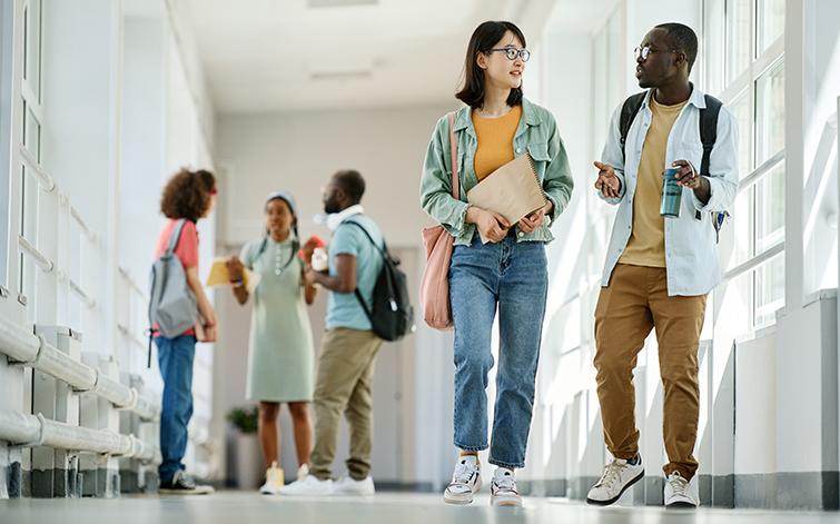 High school students talking in hallway