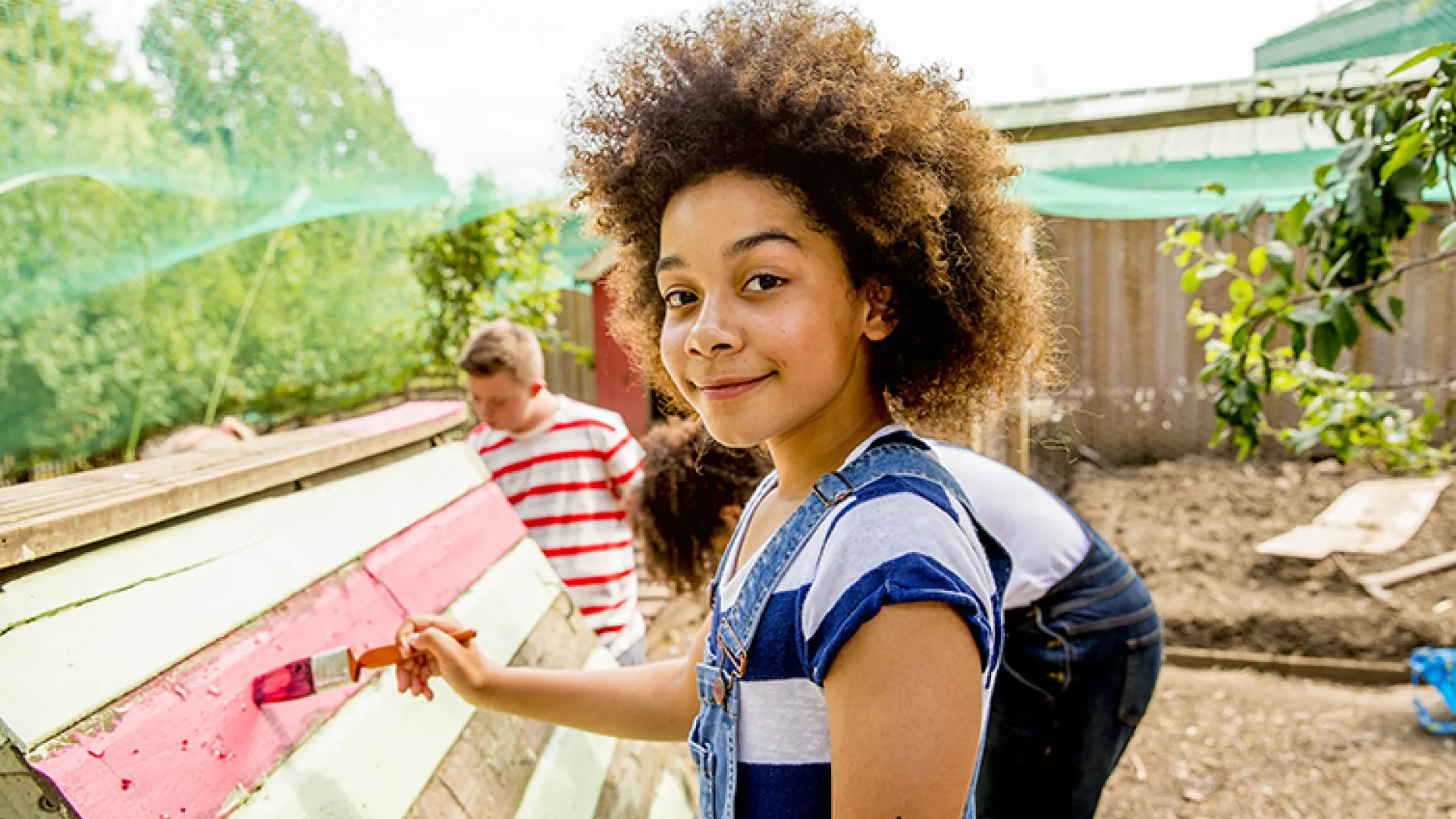 Child painting outside