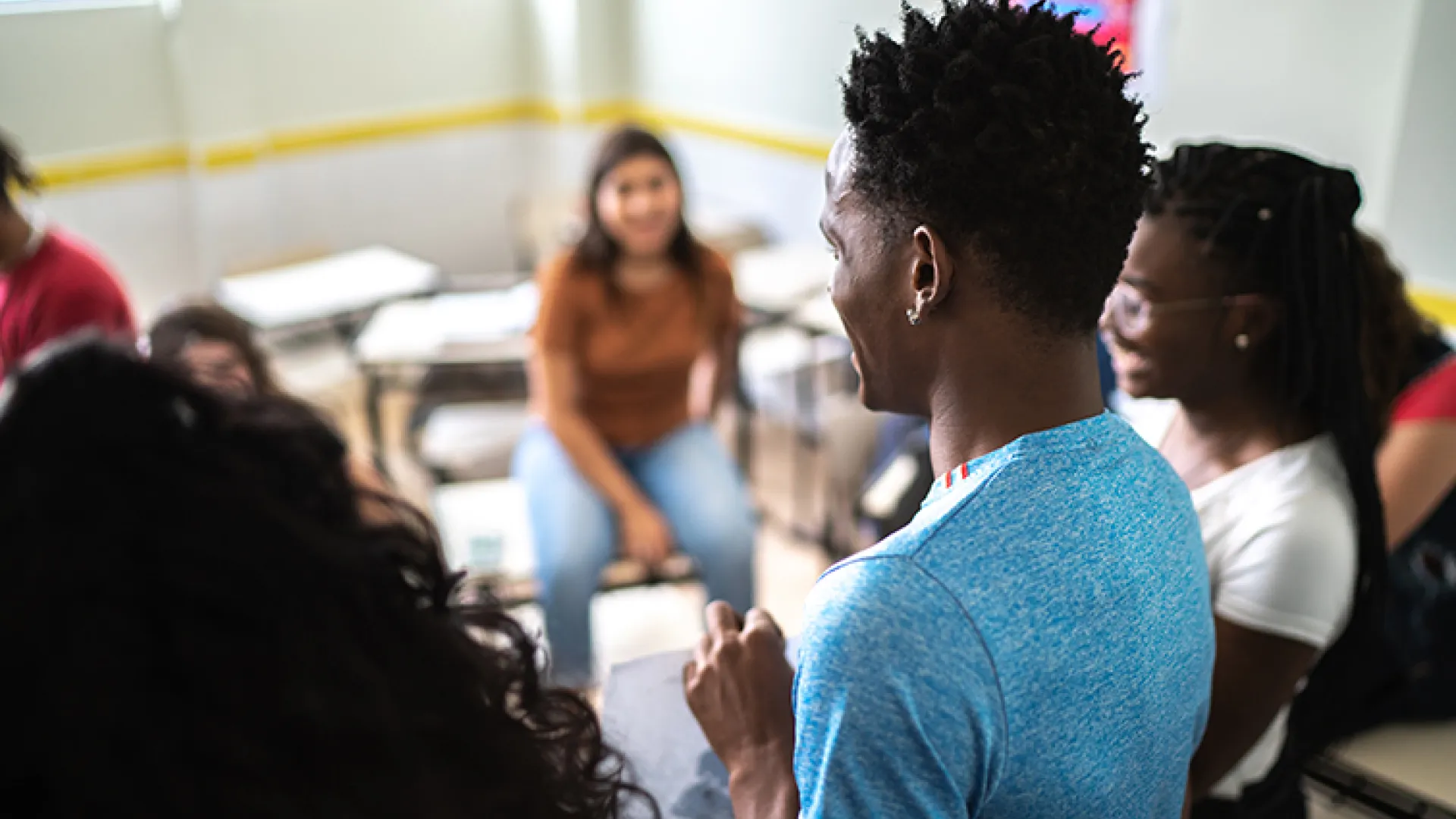 High school student giving presentation to class
