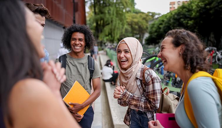 Young students laughing together on campus