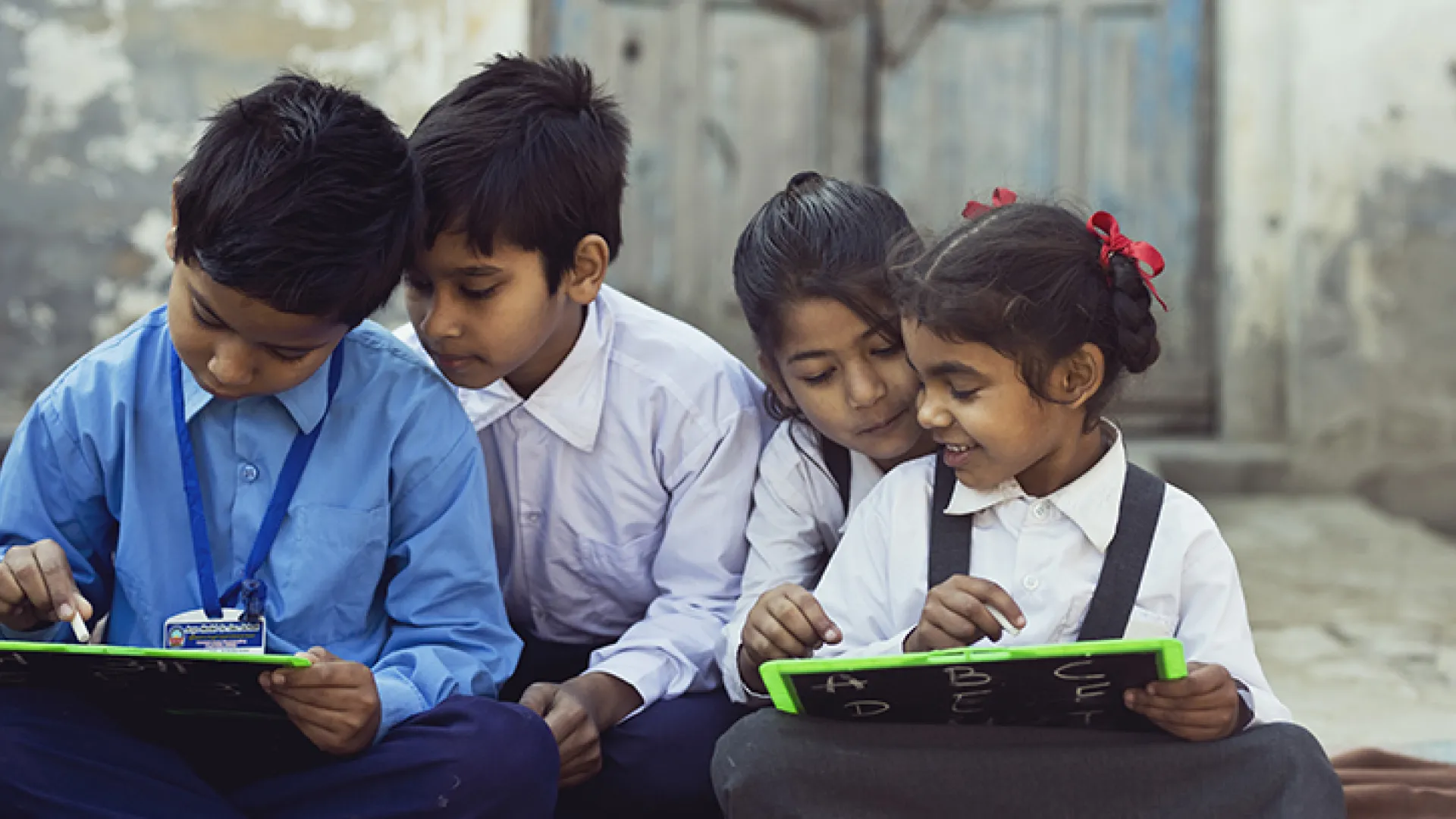 Indian schoolchildren writing on slates