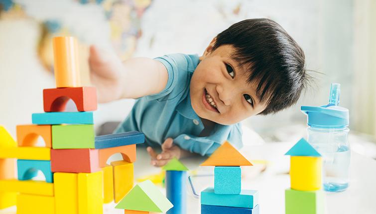 Preschool boy playing with blocks