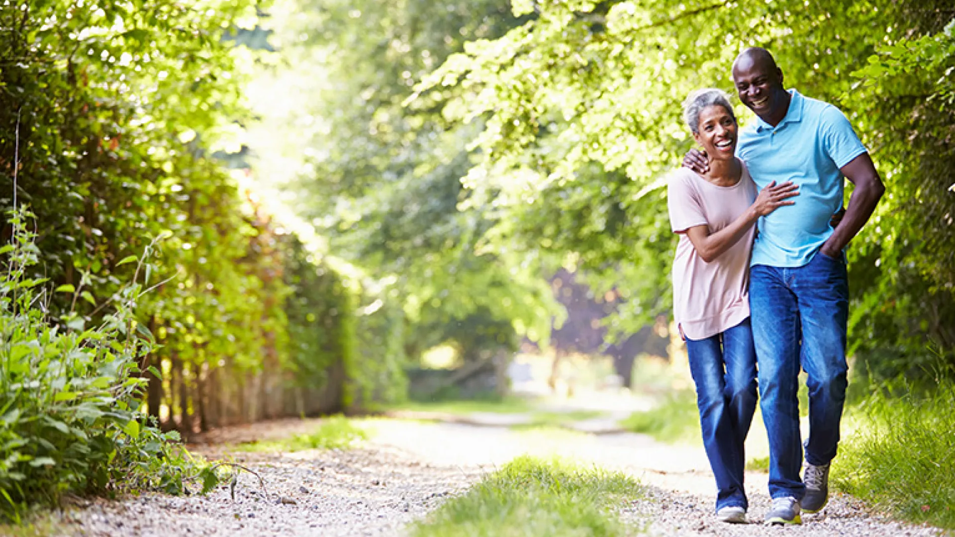 Older African American couple walking outside