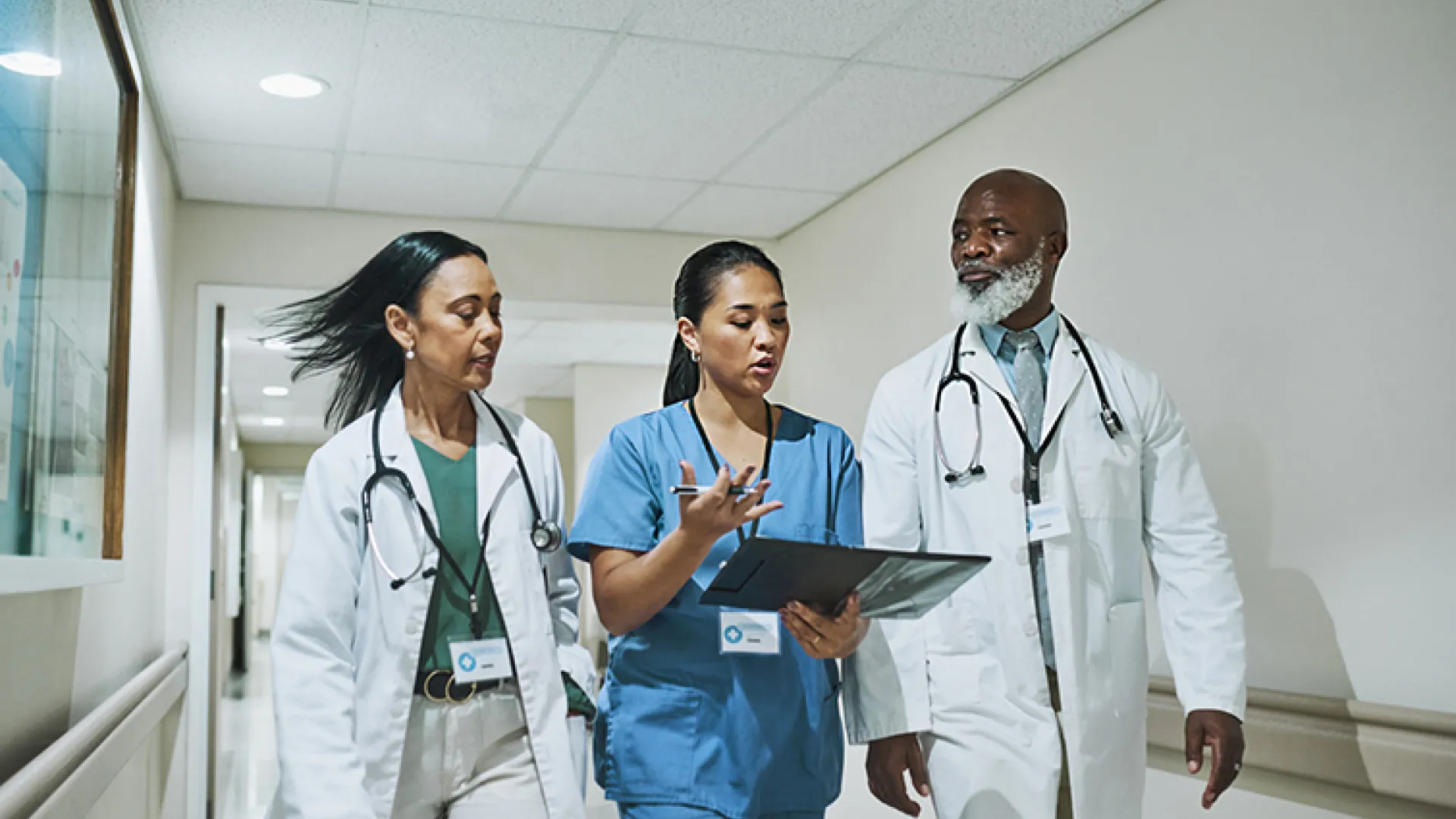 health care workers walking and talking