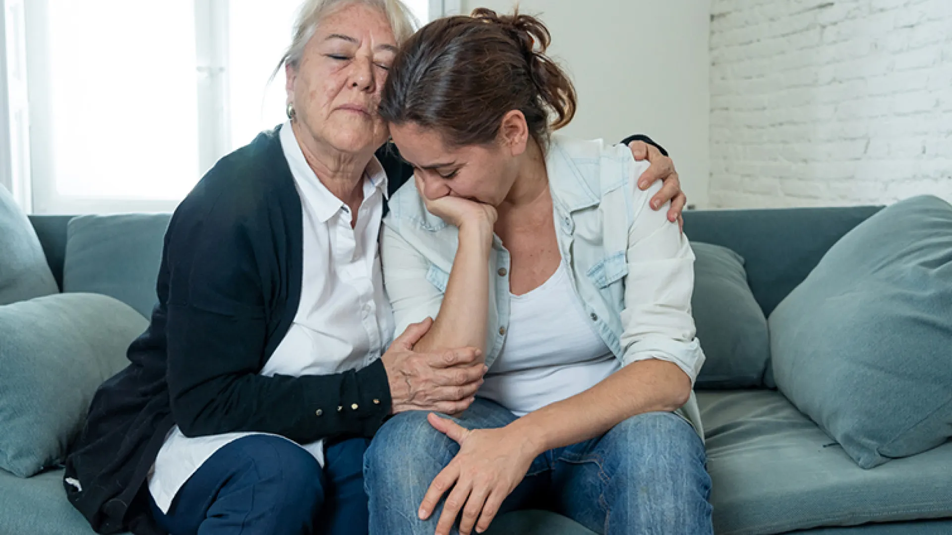 two women grieving together