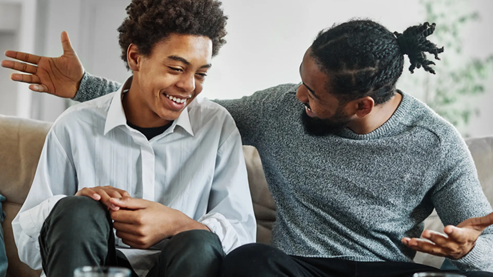 man and teen son having a discussion