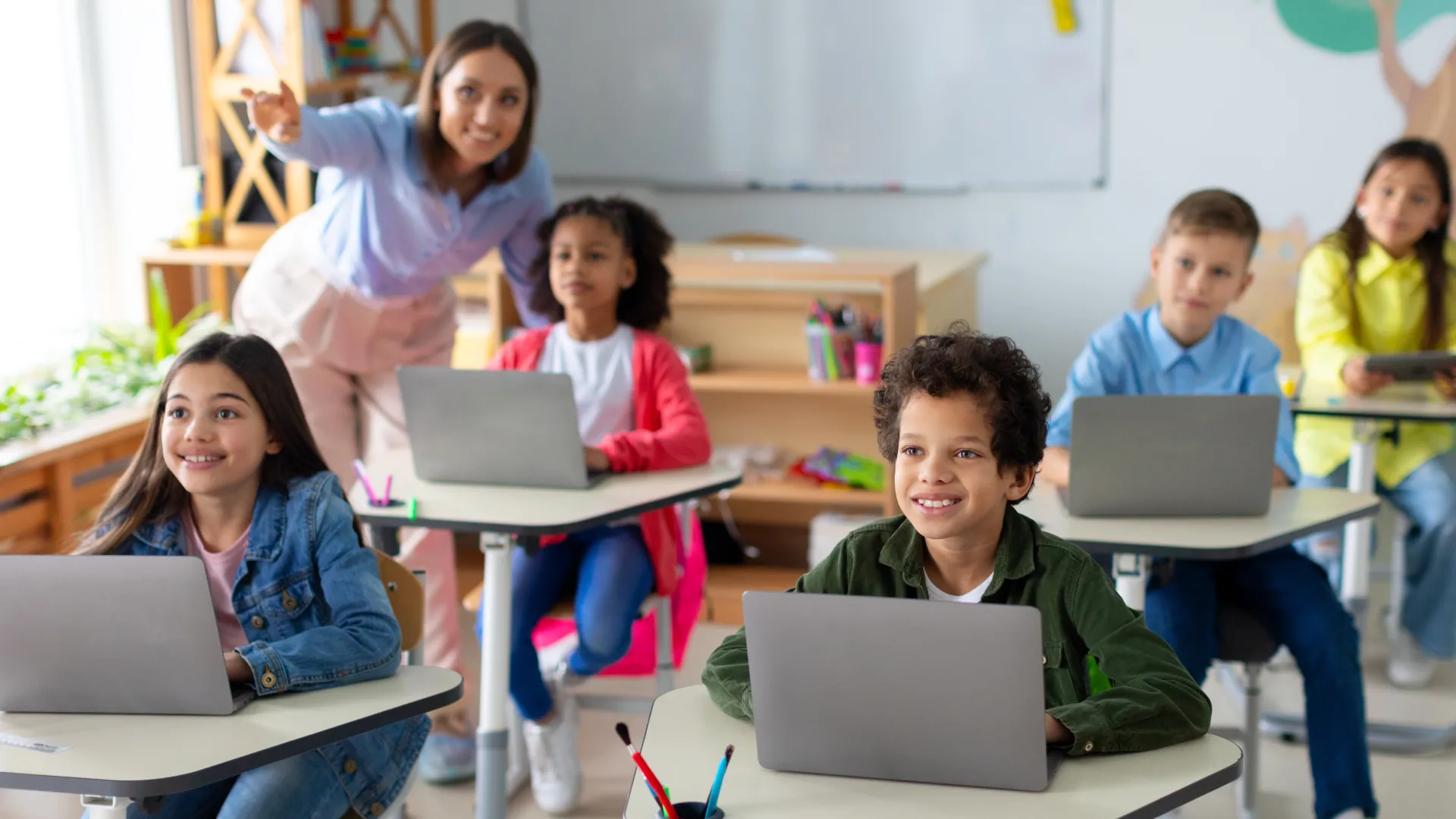 Middle school children on computers in classroom