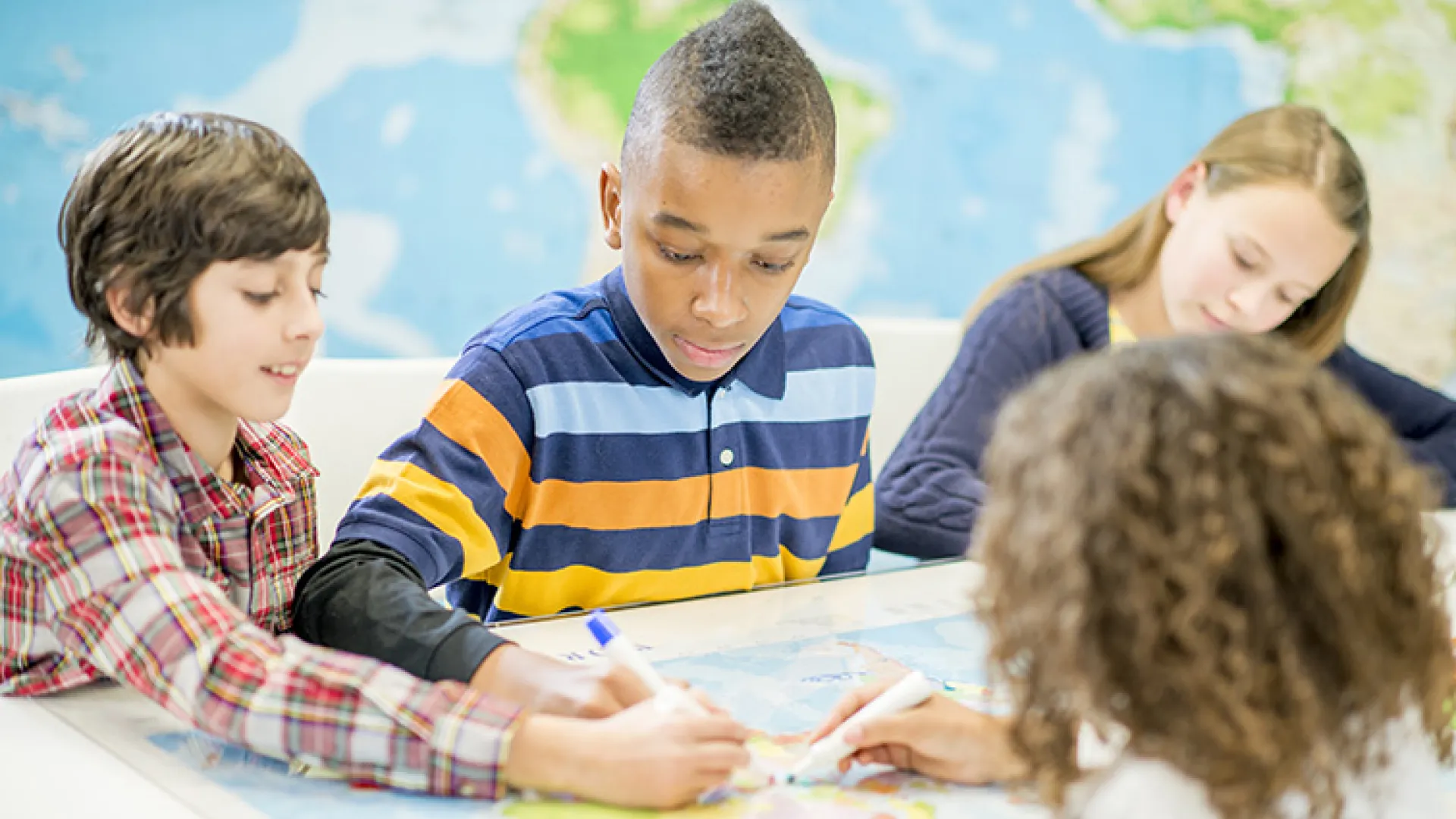 Students working together with a map