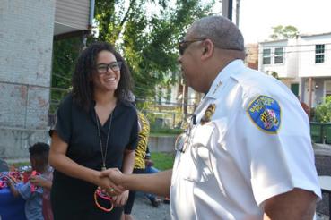 Baltimore police officer and community member