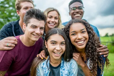 Happy teenagers smiling to the camera