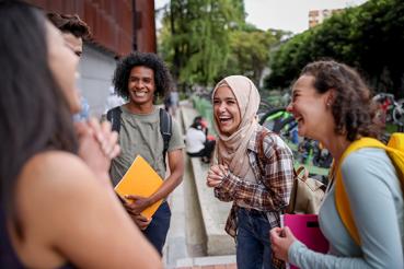Young students laughing together on campus