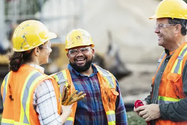 Construction workers laughing together