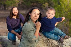 American Indian family with baby outside