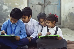 Indian schoolchildren writing on slates
