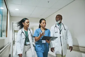 health care workers walking and talking