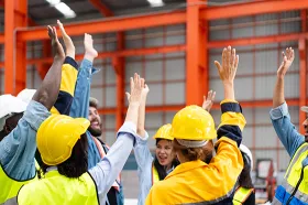 Mexican workers raising their hands