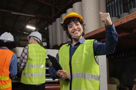 Factory worker giving the thumbs up