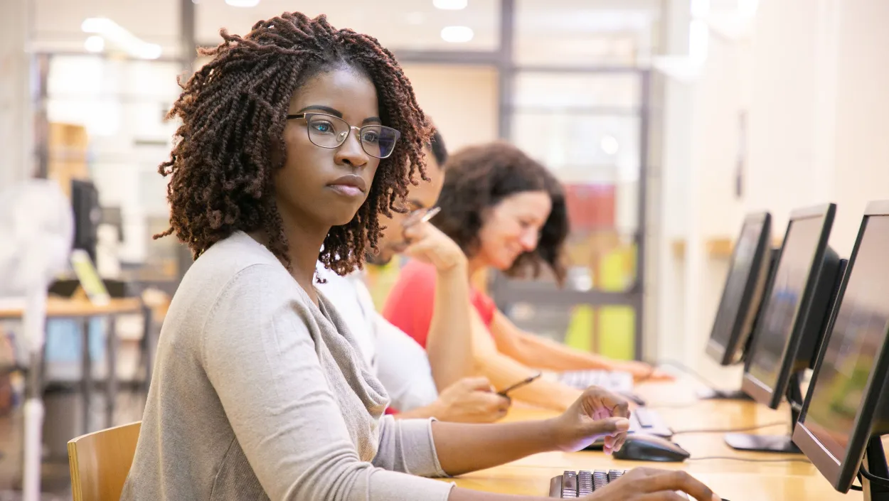 Girl with glasses at computer