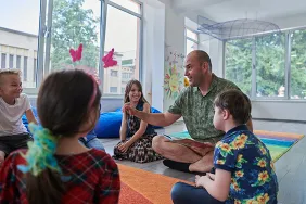 Preschool teacher with young students