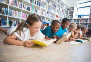 Kids sitting on floor reading books