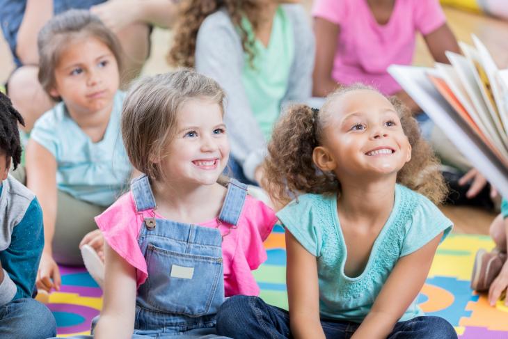 Little girls enjoy story time during after school program