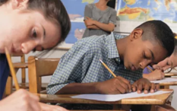 black and white students taking a test