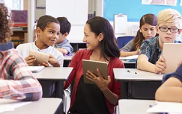 Image of teacher and middle school students 