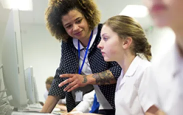 Image of high school teacher student at computer