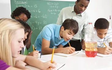Image of middle school students working on science project