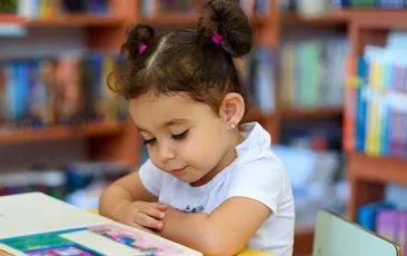 Image of preschool girl reading 