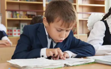 Tajik boy reading