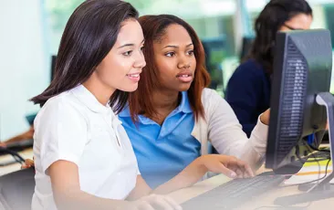 Image of older students at computer 