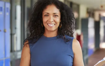 Image of principal in a hallway