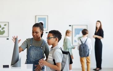 Kids looking at an exhibit in a museum