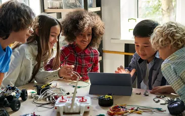 Middle school kids working on an engineering project