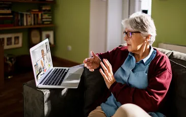 Older patient having a telehealth call with physician