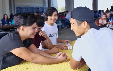 Teen students laughing together