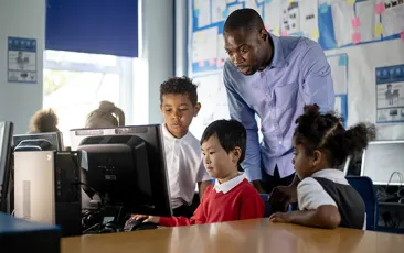 Computer science teacher with young students