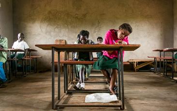 Student working at a desk in Zambia