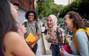 Young students laughing together on campus
