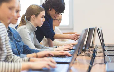 Computer science teacher with students