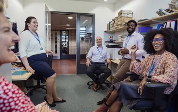 group of teachers laughing together