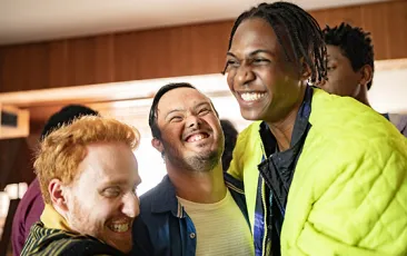 young disabled man having fun with friends